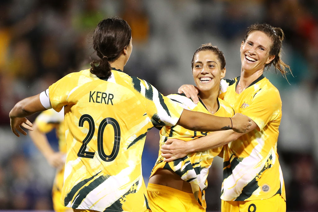 Katrina Gorry of the Matildas celebrates with her team mates Sam Kerr and Elise Kellond-Knight of the Matildas after scoring a goal during the Women's Olympic Football Tournament Qualifier match between the Australian Matildas and Chinese Taiepi at Campbe Katrina Gorry of the Matildas celebrates with her team mates Sam Kerr and Elise Kellond-Knight of the Matildas after scoring a goal during the Women's Olympic Football Tournament Qualifier match between the Australian Matildas and Chinese Taiepi at Campbelltown Sports Stadium on February 07, 2020 in Sydney, Australia. (Photo by Mark Kolbe/Getty Images)