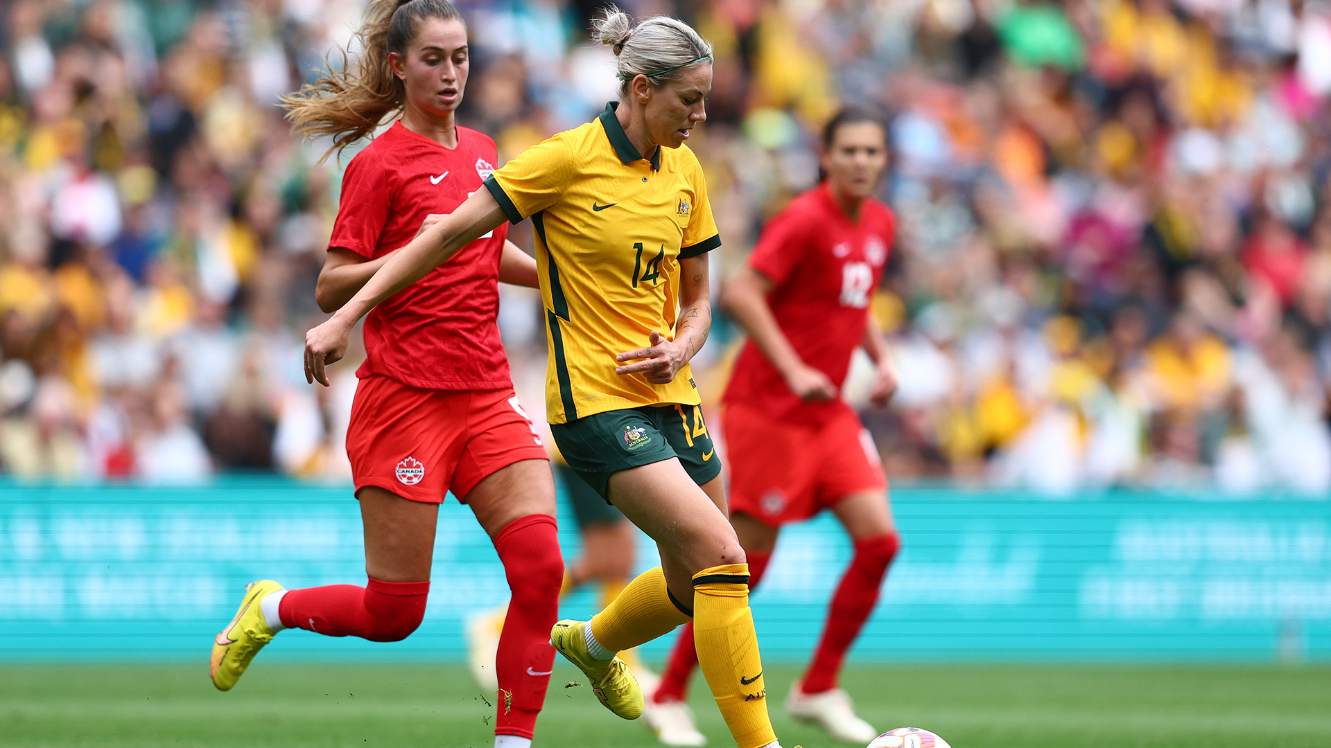 Alanna Kennedy playing for Australia against Canada in 2022 at Suncorp Stadium.