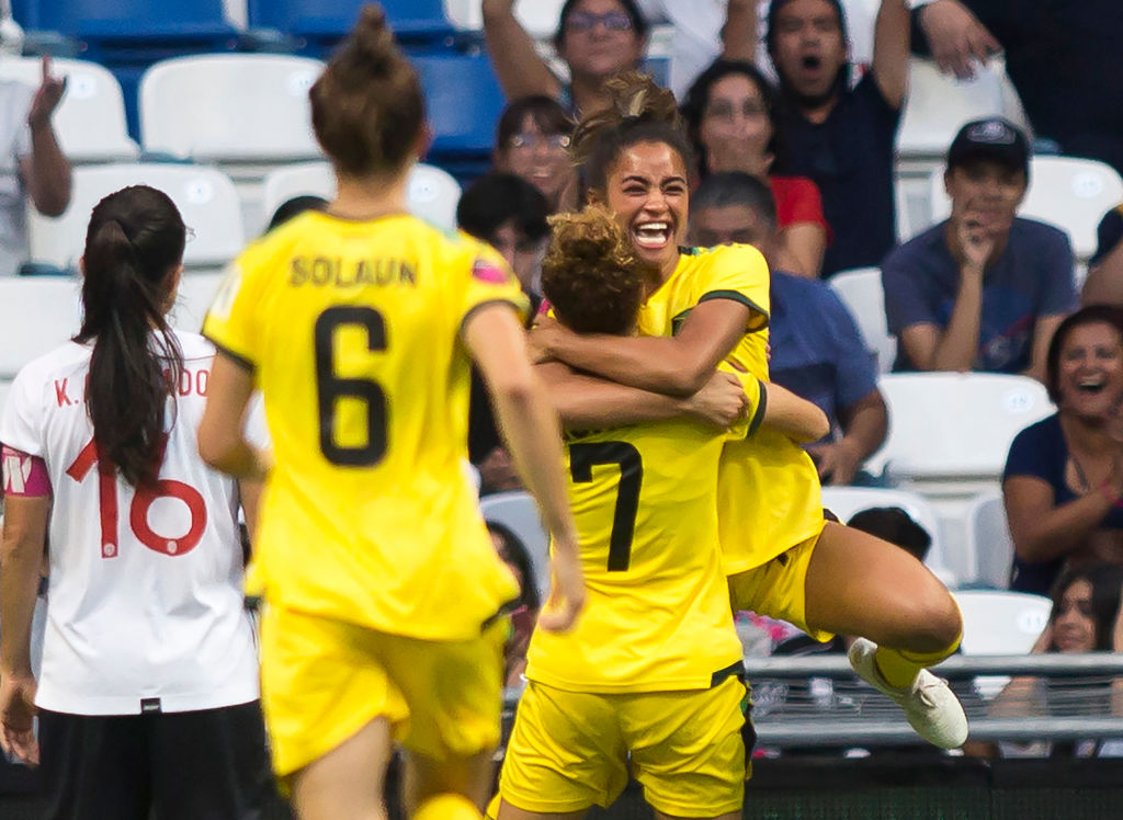 Jamaica's Kalyssa van Zanten (R) celebrates with teammates after scoring a goal against Costa Rica during their 2022 Concacaf women's championship third-place football match, at the BBVA Bancomer stadium in Monterrey, Nuevo Leon State, Mexico on July 18, Jamaica's Kalyssa van Zanten (R) celebrates with teammates after scoring a goal against Costa Rica during their 2022 Concacaf women's championship third-place football match, at the BBVA Bancomer stadium in Monterrey, Nuevo Leon State, Mexico on July 18, 2022. (Photo by Julio Cesar AGUILAR / AFP) (Photo by JULIO CESAR AGUILAR/AFP via Getty Images)