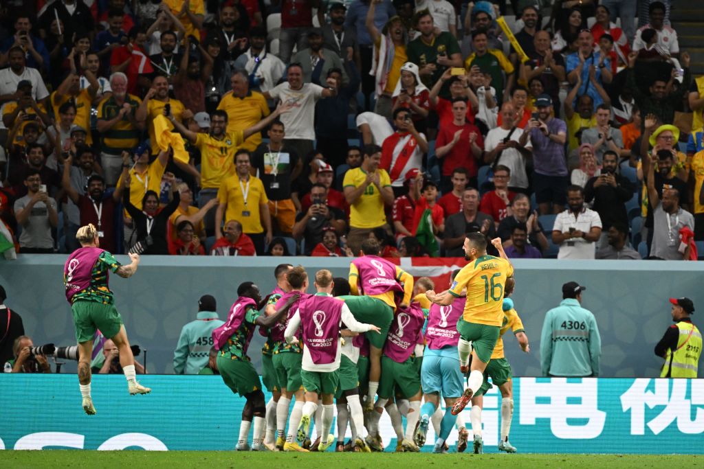 Mathew Leckie (C) celebrates with teammates after he scored his team's first goal during the Qatar 2022 World Cup Group D football match between Australia and Denmark at the Al-Janoub Stadium in Al-Wakrah, south of Doha on November 30, 2022. (Photo by NAT Mathew Leckie (C) celebrates with teammates after he scored his team's first goal during the Qatar 2022 World Cup Group D football match between Australia and Denmark at the Al-Janoub Stadium in Al-Wakrah, south of Doha on November 30, 2022. (Photo by NATALIA KOLESNIKOVA / AFP) (Photo by NATALIA KOLESNIKOVA/AFP via Getty Images)