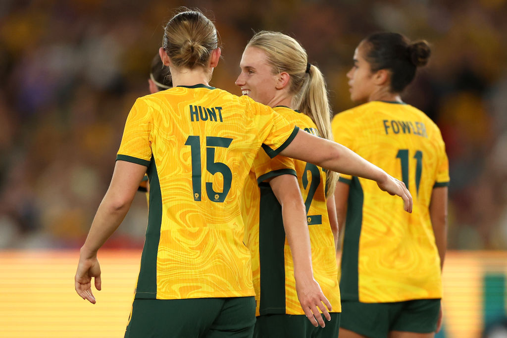 MELBOURNE, AUSTRALIA - FEBRUARY 28: Kaitlyn Torpey of Australia celebrates with team mates after scoring her second goal during the AFC Women's Olympic Football Tournament Paris 2024 Asian Qualifier Round 3 match between Australia Matildas and Uzbekistan at Marvel Stadium on February 28, 2024 in Melbourne, Australia. (Photo by Robert Cianflone/Getty Images