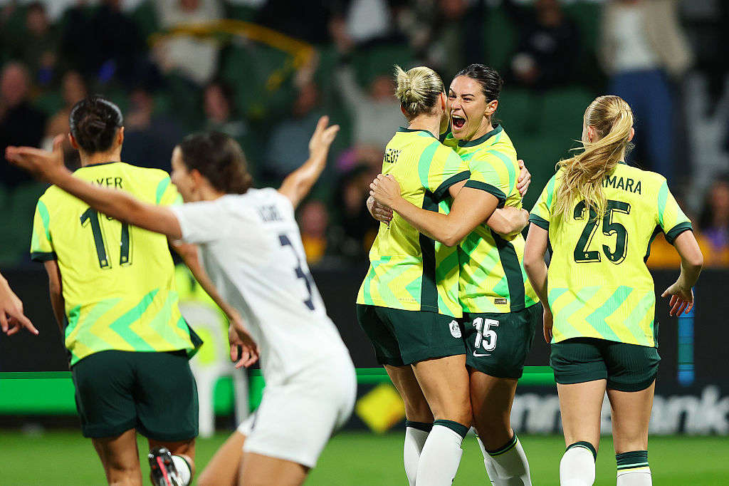 PERTH, AUSTRALIA - JUNE 26: Emily Gielnik of Australia celebrates with teammate Alanna Kennedy after scoring the teams first goal during the International Friendly match between Australia Matildas and Slovenia at HBF Park on June 26, 2025 in Perth, Australia. (Photo by Paul Kane/Getty Images)