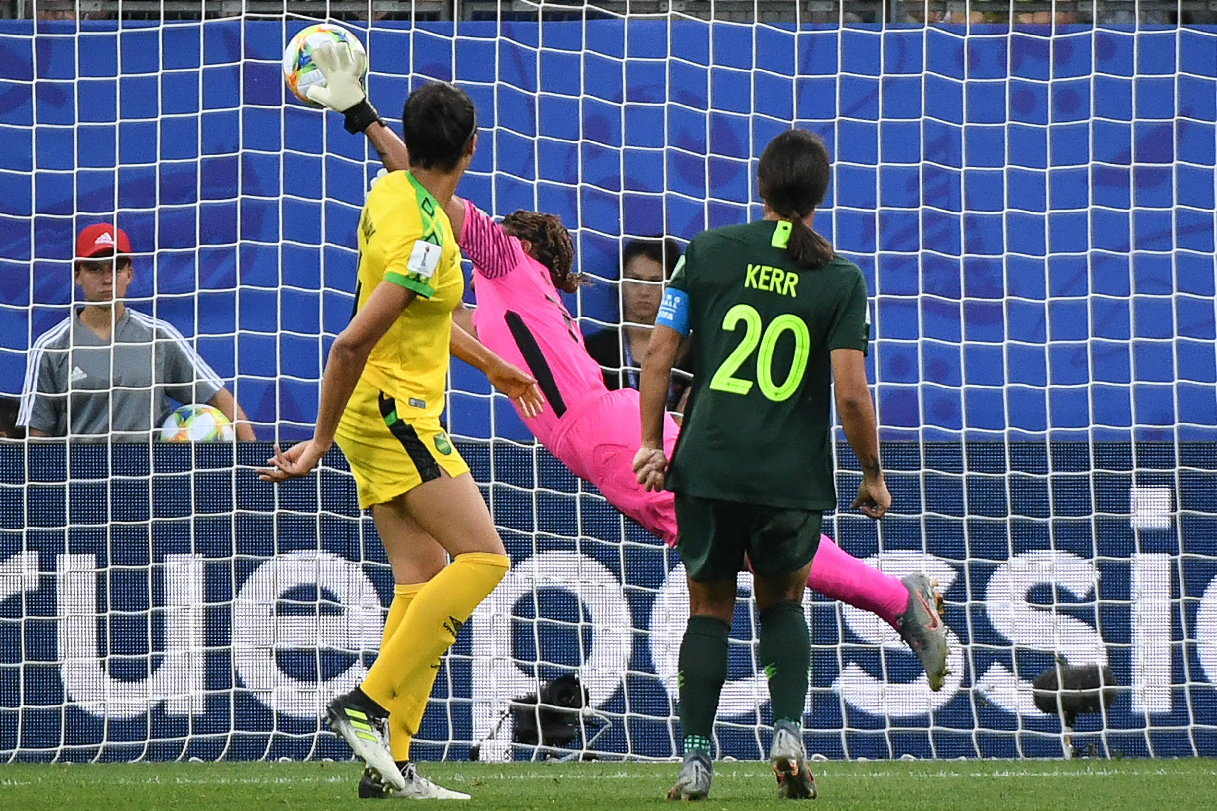 Sam Kerr watches on as her first header beats the Jamaican keeper