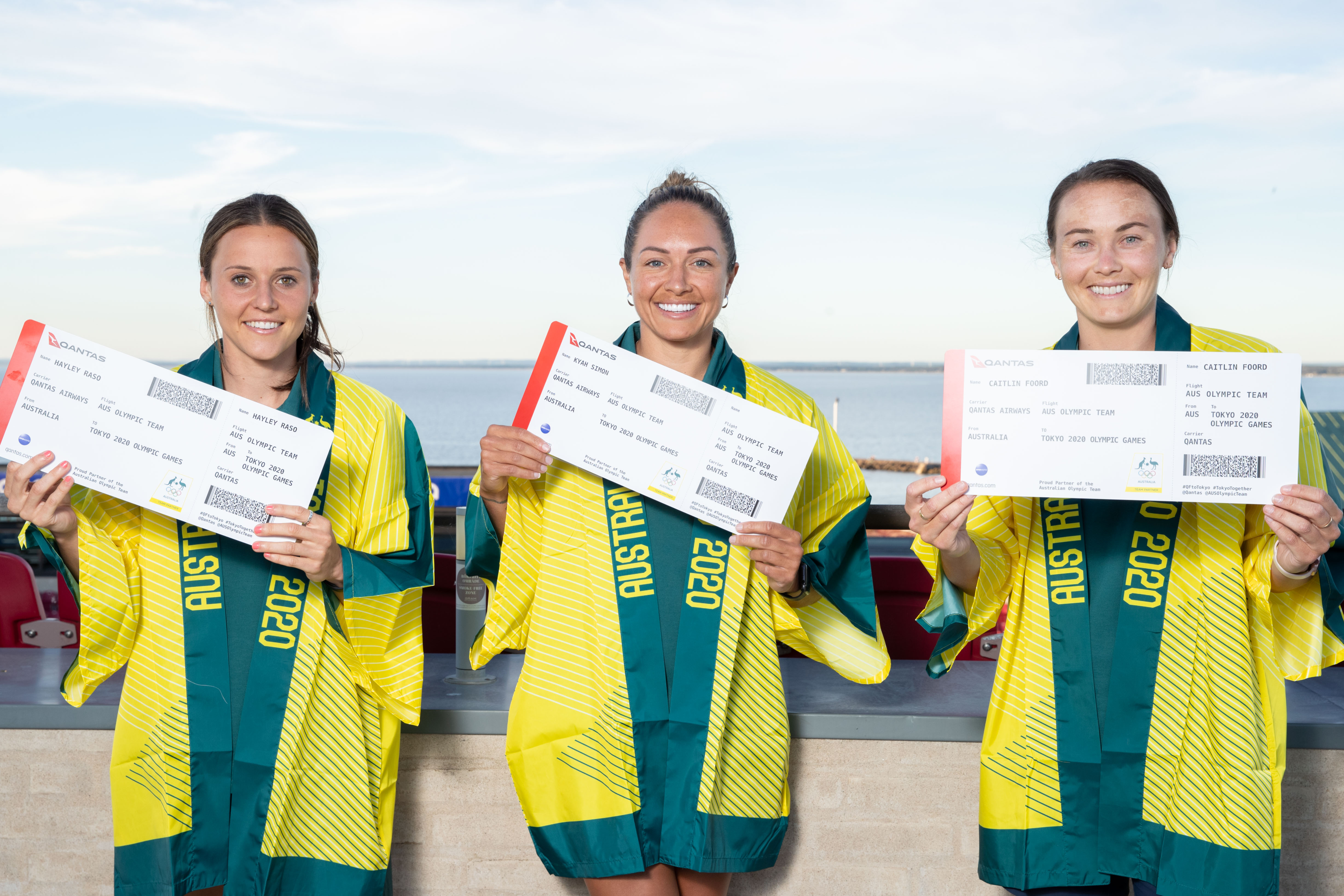 Hayley Raso, Kyah Simon and Caitlin Foord with their Tokyo 2020 Olympic Qantas boarding passes