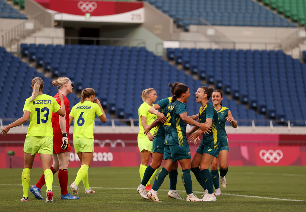 SAITAMA, JAPAN - JULY 24: Sam Kerr #2 of Team Australia celebrates with team mates after scoring their side's second goal during the Women's First Round Group G match between Sweden and Australia on day one of the Tokyo 2020 Olympic Games at Saitama Stadium on July 24, 2021 in Saitama, Japan. (Photo by Francois Nel/Getty Images)