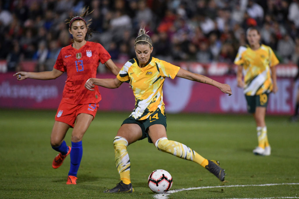 Alanna Kennedy #14 of Australia makes a pass past Alex Morgan #13 of the United States at Dick's Sporting Goods Park on April 4, 2019 in Commerce City, Colorado. (Photo by Michael Ciaglo/Getty Images)