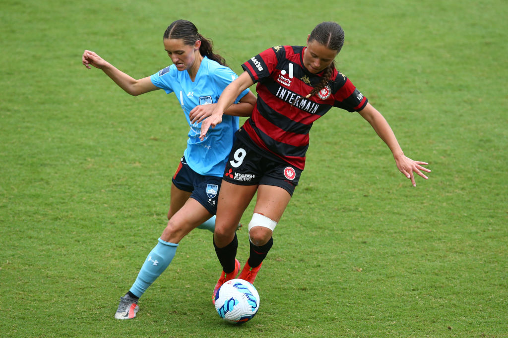 Bryleeh Henry and Jess Nash battle for the ball 