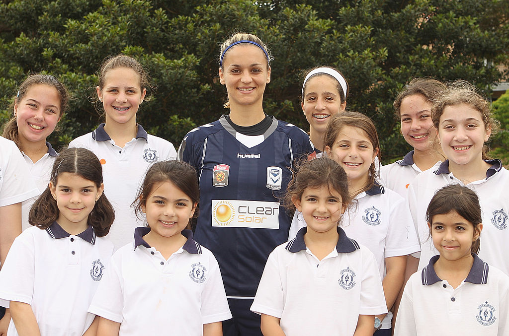 Melissa Barbieri of the Melbourne Victory poses with school children during the W-League Season Launch at the University of NSW Campus on November 1, 2010 in Sydney, Australia. (Photo by Mark Kolbe/Getty Images)
