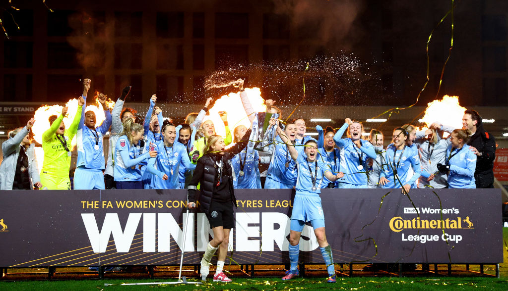 Steph Houghton and Ellen White of Manchester City lift the FA Women's Continental Tyres League cup trophy following their side's victory in the FA Women's Continental Tyres League cup final match between Chelsea women and Manchester City women at The Cherry Red Records Stadium on March 05, 2022 in Wimbledon, England. (Photo by Clive Rose/Getty Images)