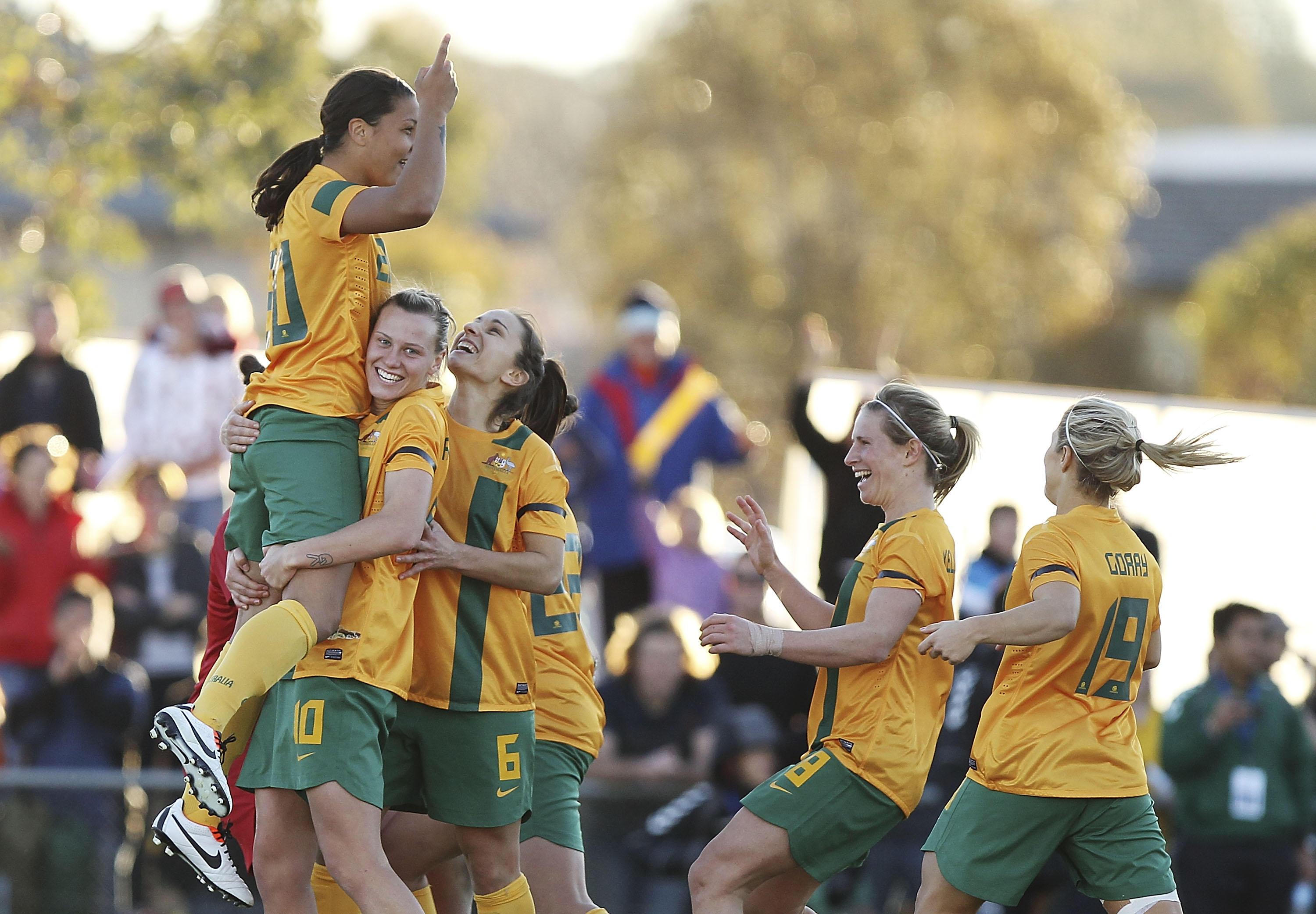 Australia congratulates Samantha Kerr after winning the penalty shoot out during the Women's International match between the Australian Matildas and the New Zealand Football Ferns at McKellar Park on June 16, 2013 in Canberra, Australia. (Photo by Stefan Postles/Getty Images)