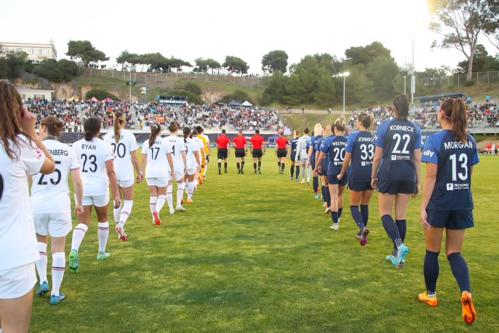Portland Thorns FC and San Diego Wave FC walk out before a game between Portland Thorns FC and San Diego Wave FC at Torero Stadium on March 26, 2022 in San Diego, California. (Photo by Jenny Chuang/ISI Photos/Getty Images)