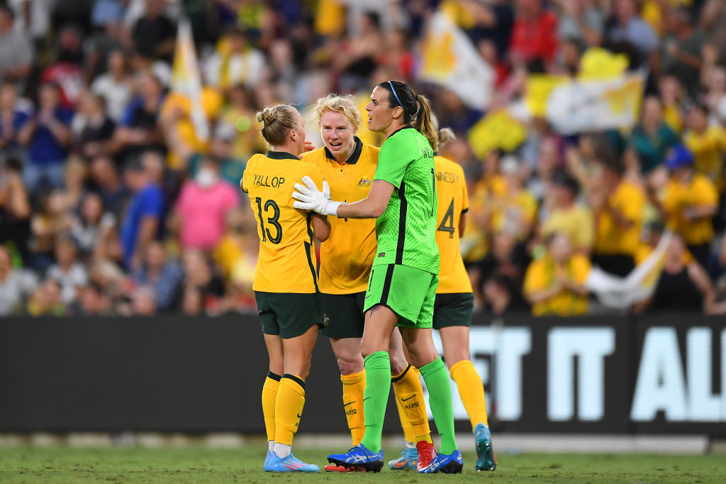 Tameka Yallop, Clare Polkinghorne and Lydia Williams of Australia celebrate victory during the International Women's match between the Australia Matildas and the New Zealand Football Ferns at Queensland Country Bank Stadium on April 08, 2022 in Townsville, Australia. (Photo by Albert Perez/Getty Images)