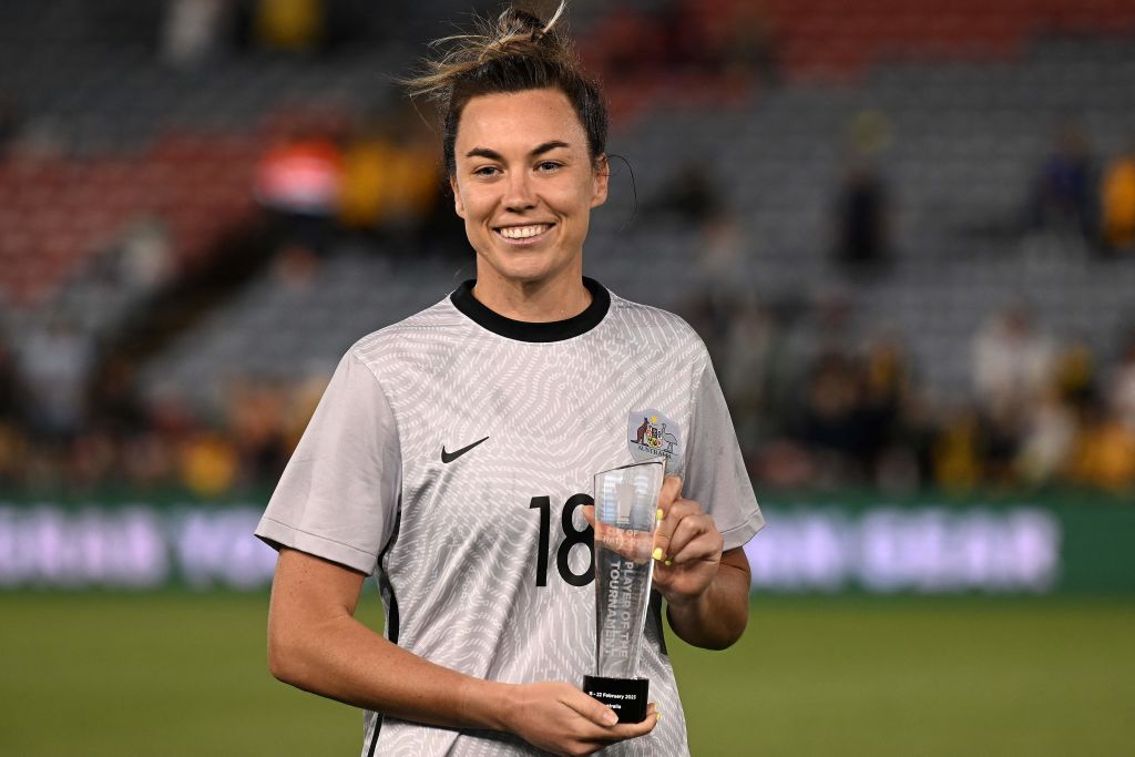Australia's Mackenzie Arnold poses with her player of the competition award after the 2023 Cup of Nations womens football match between Australia and Jamaica in Newcastle on February 22, 2023. - -- IMAGE RESTRICTED TO EDITORIAL USE - STRICTLY NO COMMERCIAL USE -- (Photo by SAEED KHAN / AFP) / -- IMAGE RESTRICTED TO EDITORIAL USE - STRICTLY NO COMMERCIAL USE -- (Photo by SAEED KHAN/AFP via Getty Images)