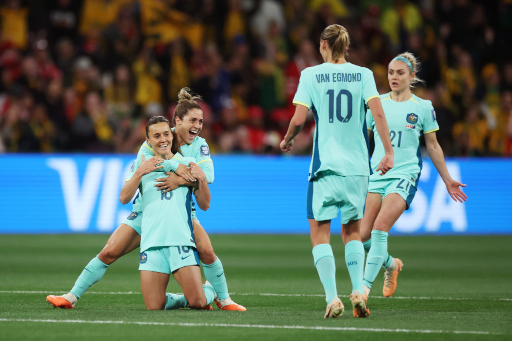 Hayley Raso (1st L) of Australia celebrates with teammate after scoring her team's first goal during the FIFA Women's World Cup Australia & New Zealand 2023 Group B match between Canada and Australia at Melbourne Rectangular Stadium on July 31, 2023 in Melbourne, Australia. (Photo by Alex Grimm - FIFA/FIFA via Getty Images)