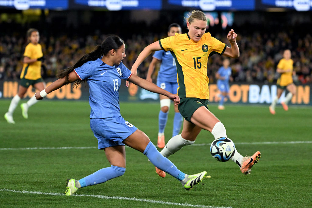 France's Selma Bacha (L) makes a cross as Australia's Clare Hunt (R) defends during the international friendly football match between Australia and France in Melbourne on July 14, 2023. (Photo by William WEST / AFP) / --IMAGE RESTRICTED TO EDITORIAL USE - STRICTLY NO COMMERCIAL USE-- (Photo by WILLIAM WEST/AFP via Getty Images)