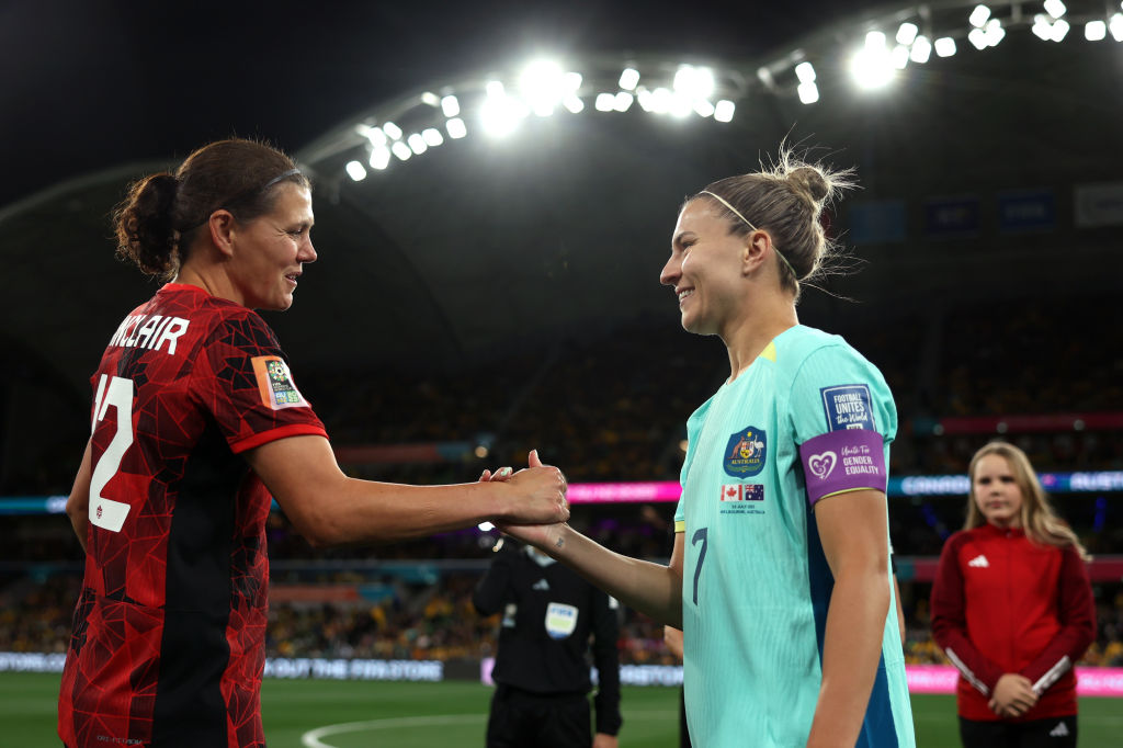 Steph Catley of Australia shakes hands with Christine Sinclair of Canada before the coin toss prior to kick off during the FIFA Women's World Cup Australia & New Zealand 2023 Group B match between Canada and Australia at Melbourne Rectangular Stadium on July 31, 2023 in Melbourne, Australia. (Photo by Alex Pantling - FIFA/FIFA via Getty Images)