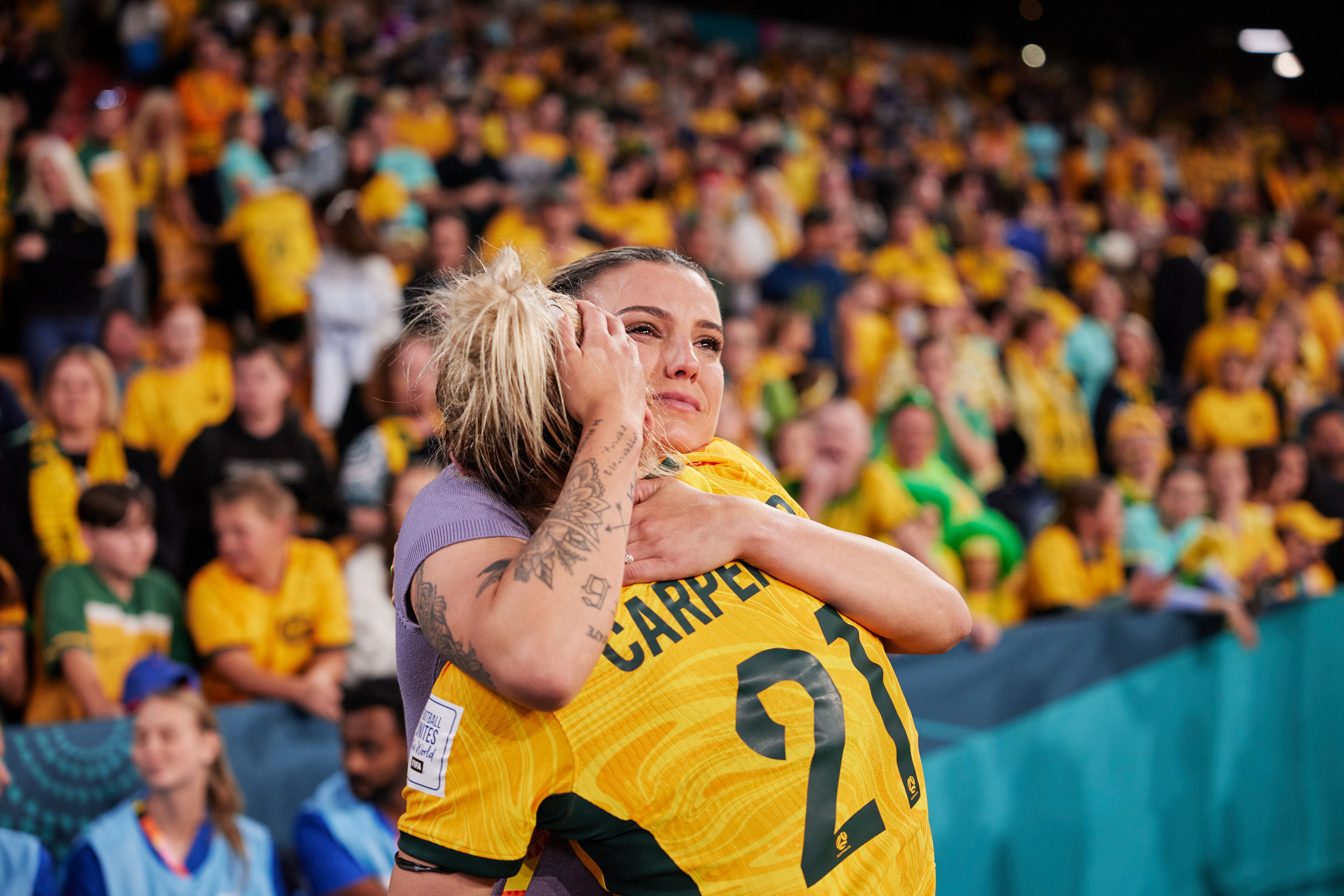 Chloe Logarzo embraces Ellie Carpenter following Australia's win over France at the FIFA Women's World Cup. (Photo: Rachel Bach/By The White Line)