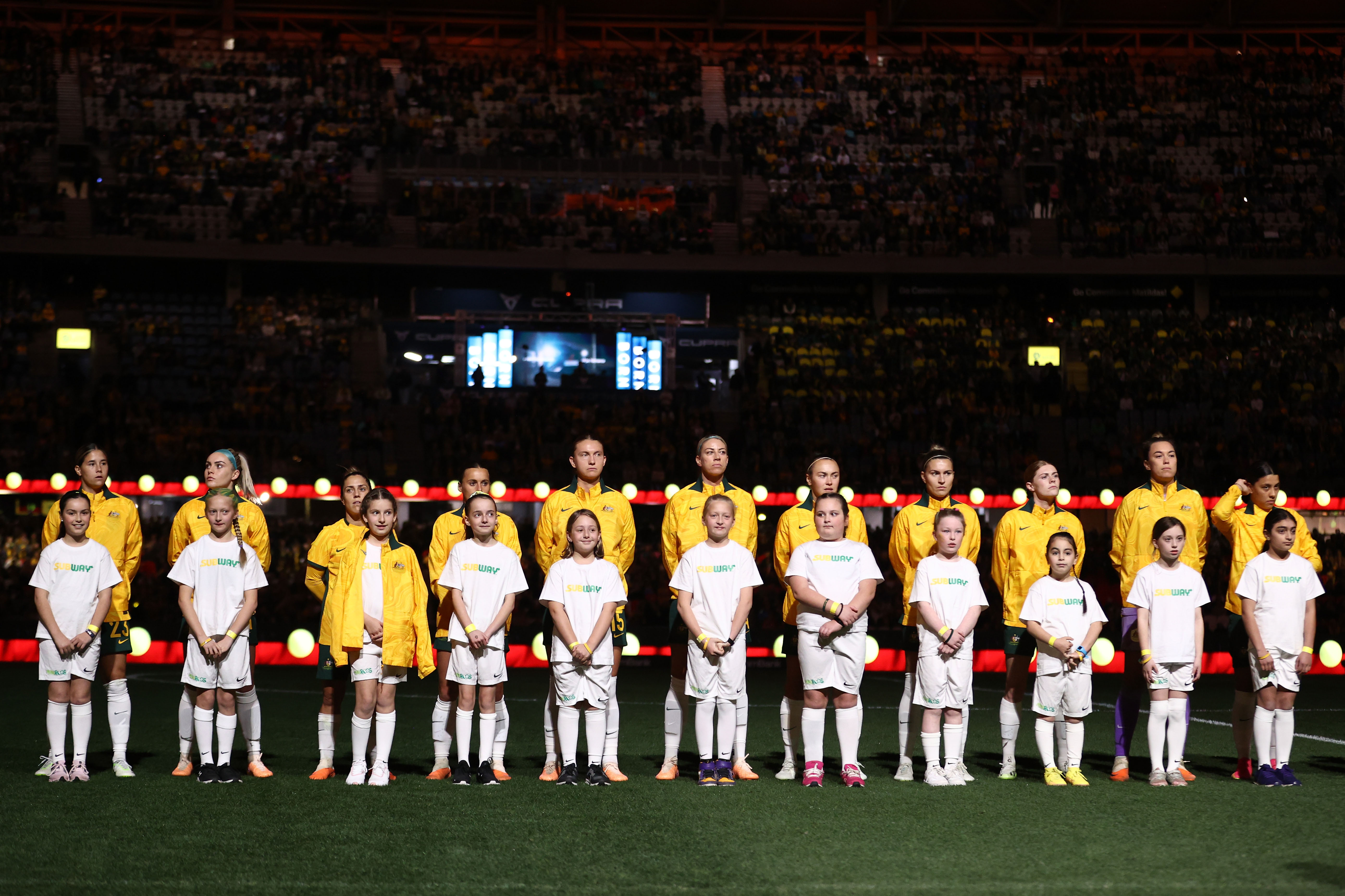 Matildas players stand together for the national anthems during the International Friendly match between the Australia Matildas and France at Marvel Stadium on July 14, 2023 in Melbourne, Australia. (Photo by Robert Cianflone/Getty Images)