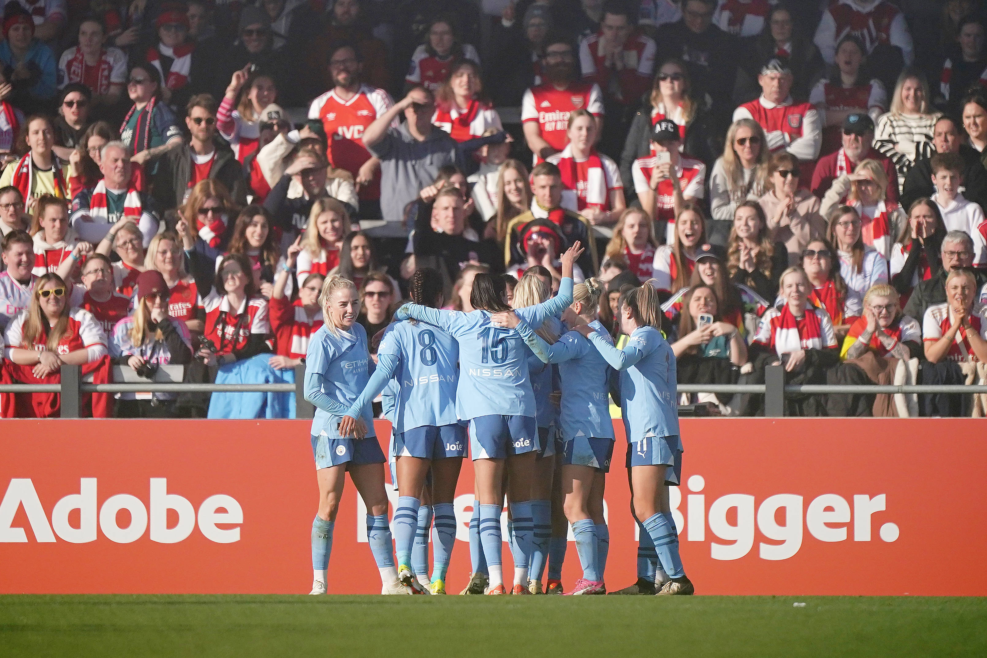 Manchester City s Laia Aleixandri (hidden) celebrates with teammates after scoring the opening goal of the game during the Adobe WFA Cup fifth round match at the Mangata Pay UK Stadium, Borehamwood.