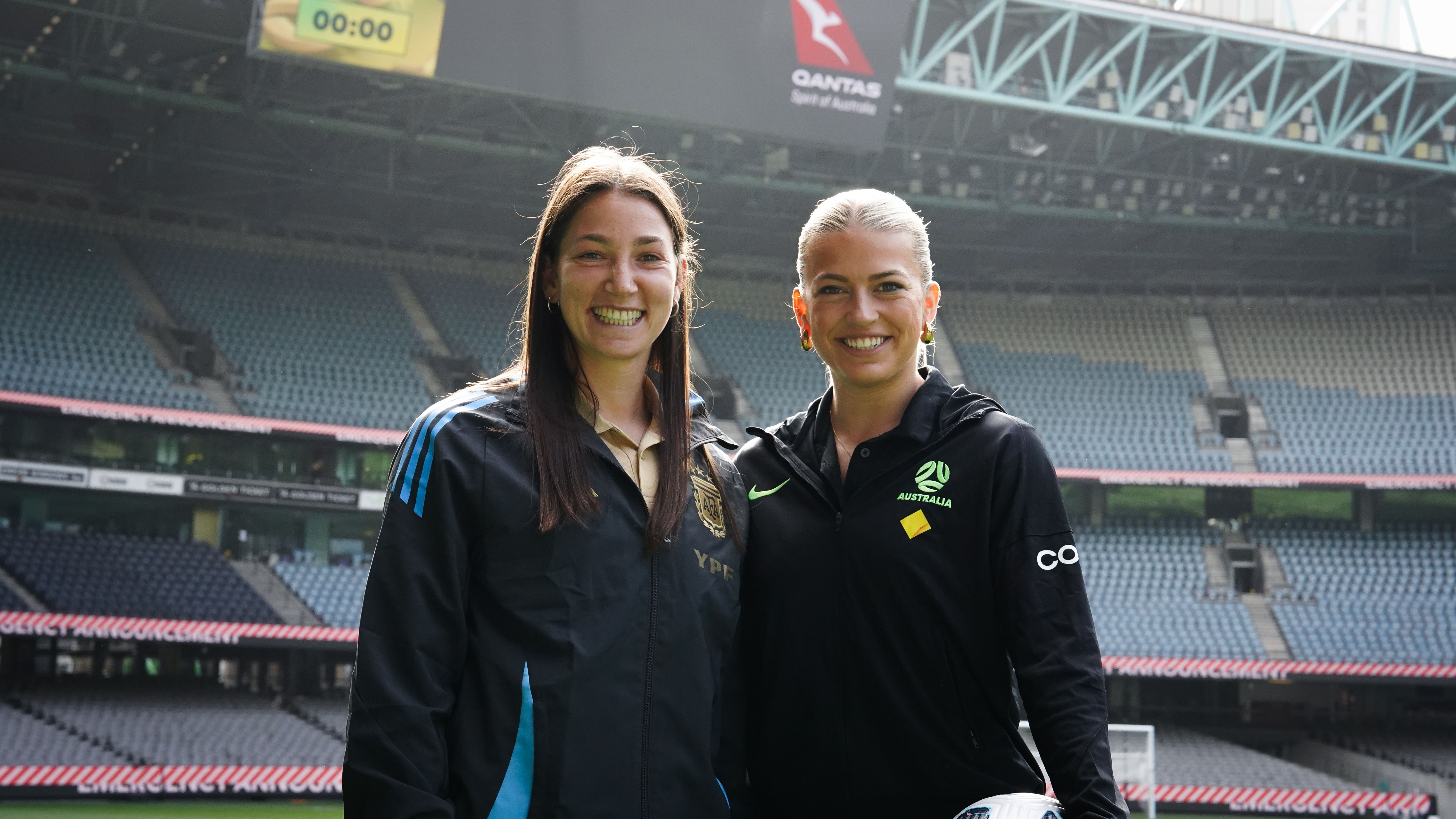 Argentina's Aldana Cometti and Australia's Charli Grant pose for a photo at Marvel Stadium following the pre-match press conference. (Photo: Richard McBurnie/Football Australia)