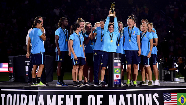 Lisa De Vanna lifts the Tournament of Nations trophy after Australia thumped Brazil 6-1 in the USA.