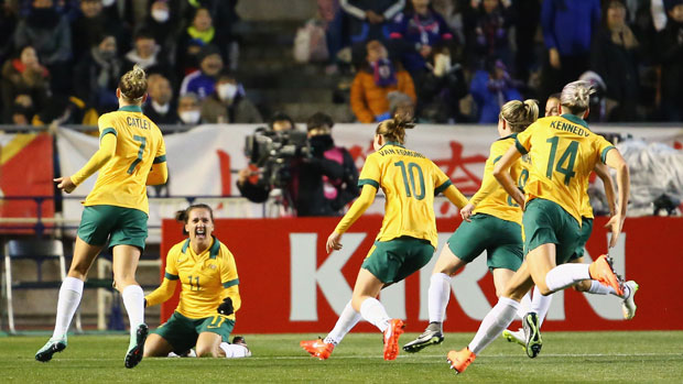 Westfield Matildas players celebrate Lisa De Vanna's opening goal against Japan in Olympic qualifying.