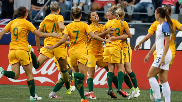 Matildas players celebrate Tameka Butt's goal against the USA.