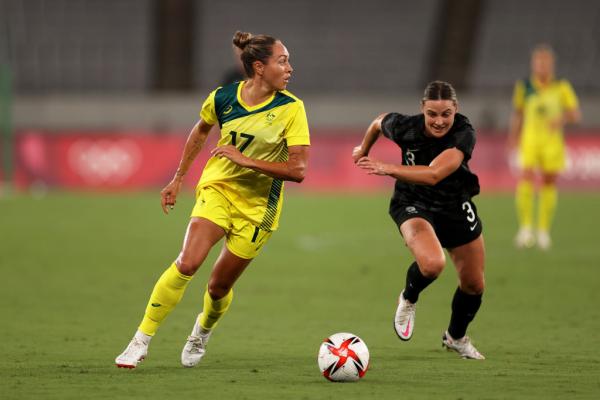Kyah Simon #17 of Team Australia battles for possession with Anna Green #3 of Team New Zealand during the Women's First Round Group G match between Australia and New Zealand during the Tokyo 2020 Olympic Games at Tokyo Stadium on July 21, 2021 in Chofu, Tokyo, Japan. (Photo by Dan Mullan/Getty Images)