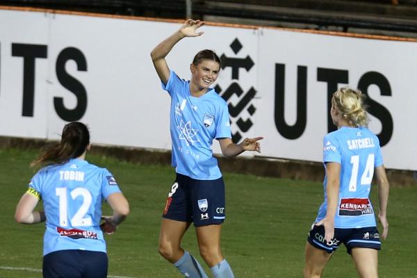 Charlize Rule celebrates scoring for Sydney FC with her teammates 