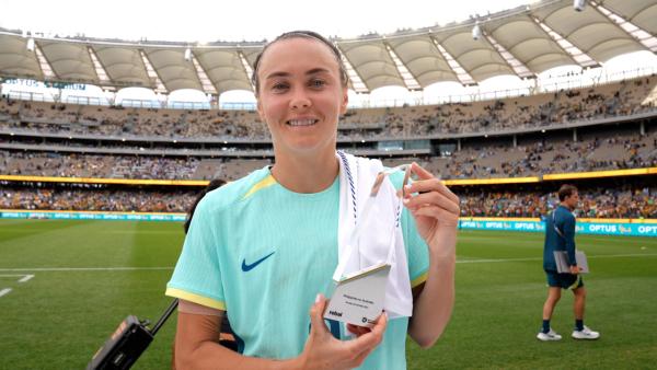 Caitlin Foord is presented with the rebel sport Player Of The Match for #PHIvAUS