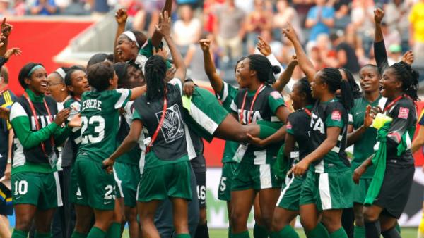 Nigeria's Ngozi Okobi celebrates with teammates after being named player of the match against Sweden.