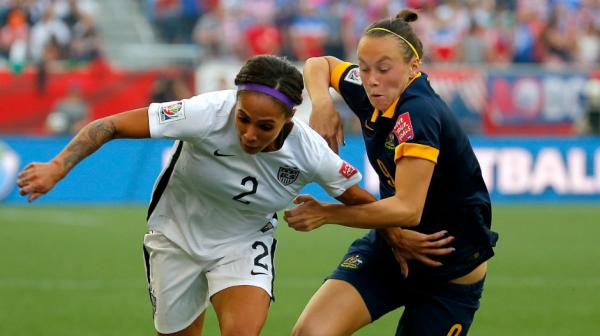 Caitlin Foord jostles for the ball with America's Sydney Leroux.
