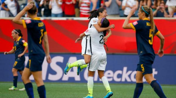 The USA celebrate Christen Press' second-half goal to put their side ahead.